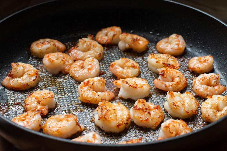 sautéing shrimp in the skillet